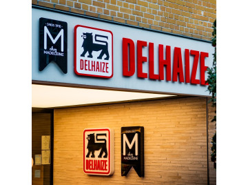 Delhaize De Haan logo